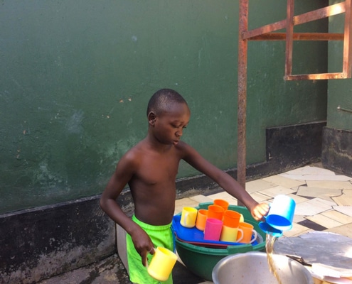 A street boy washing up