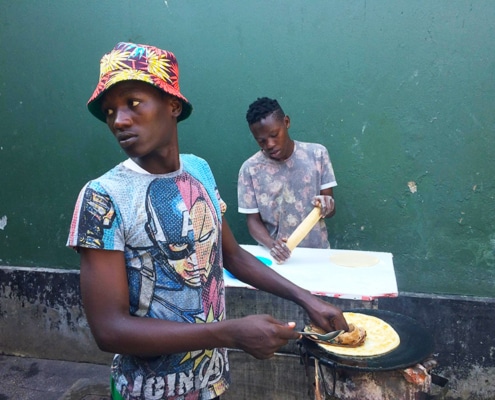 Street boys making chapatis