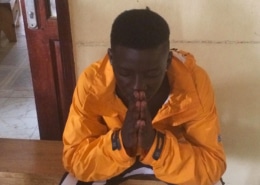 A street boy praying