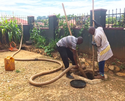 Emptying a septic tank in Uganda