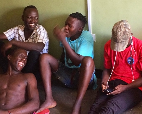 Ugandan street boys enjoying a joke