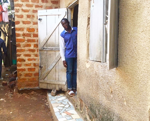 Ugandan street boy looking at accomodation