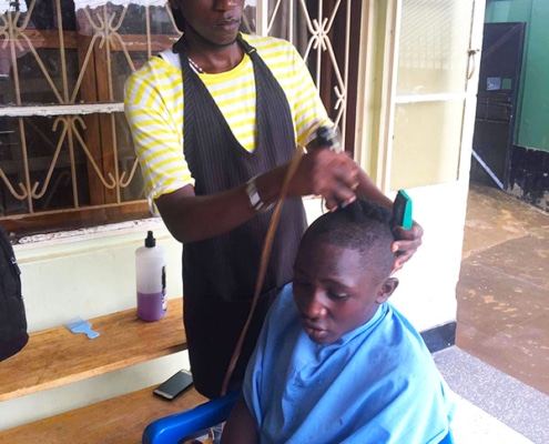 One of our boys getting his hair cut