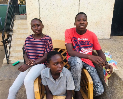 Three former street boys of Kampala