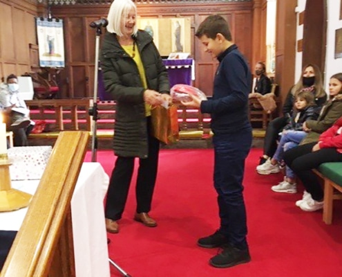 Jane presenting harry with his cap