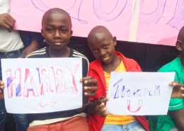 Two street boys saying Thank you