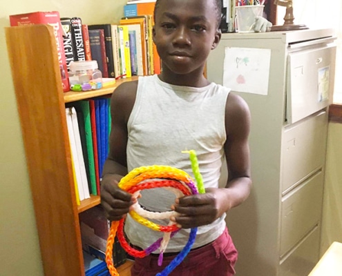 Yusuf with a skipping rope he made