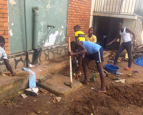 Former street boys doing gardening