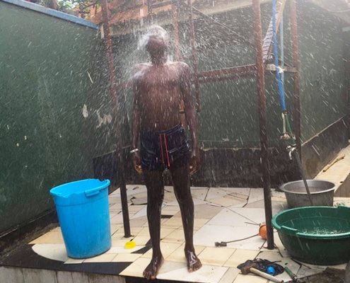 Showering under the water tank