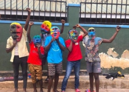 Street children with painted masks