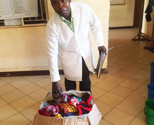 Masaka clinic doctor with donated gifts