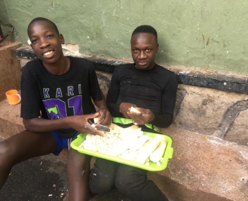 Boys preparing Cassava