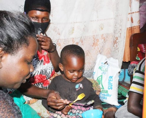 A volunteer visiting a family