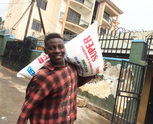 One of of boys delivering donated food