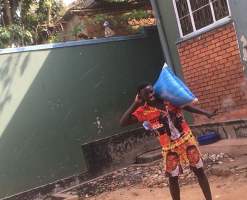 One of our boys carrying food