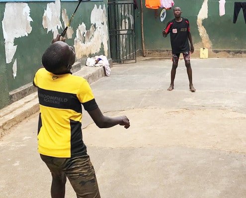 Boys at George's Place playing badminton