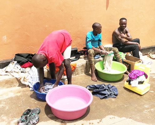Street children washing clothes