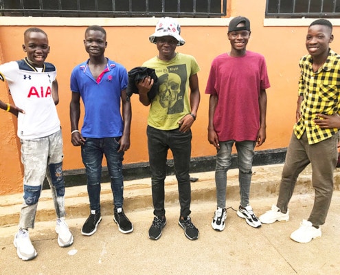 Donated trainers for former street children