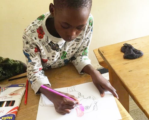 One of our boys colouring