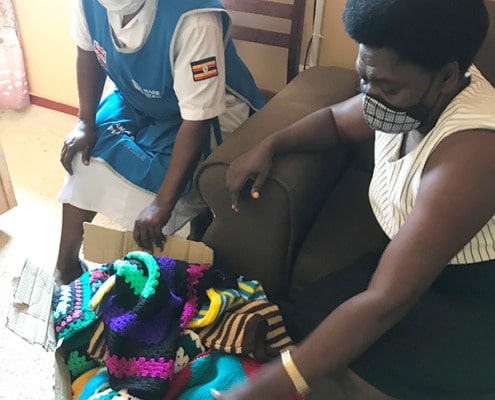 Donating fish and chip baby clothes