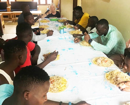 Former street children having lunch