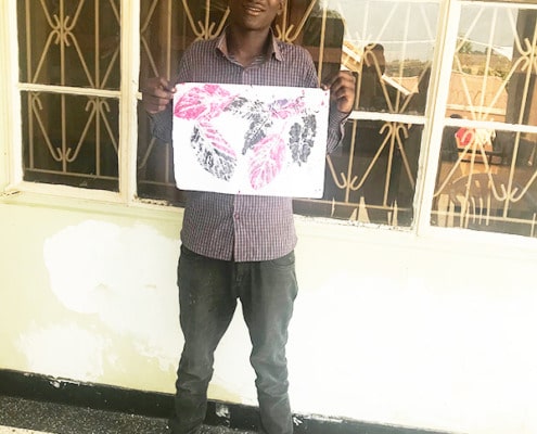 A former street boy with his art