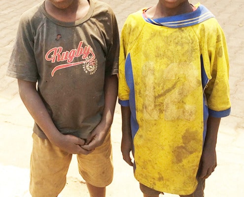 Two street children arriving