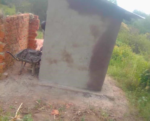 A home-made latrine built by a former street boy