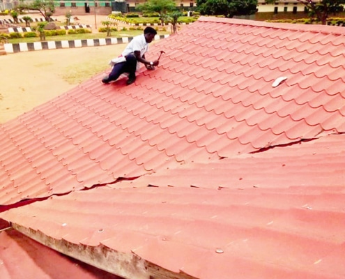 Fixing a roof in Uganda