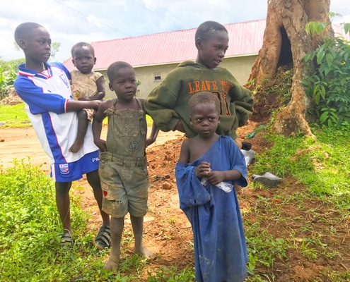 Dan with some of his family in Kayunga