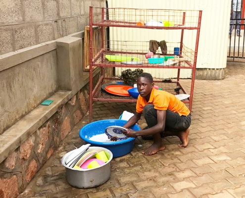 One of our boys washing the dishes