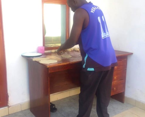 One of our charity workers making food