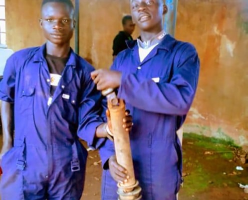 Two street children now training as mechanics