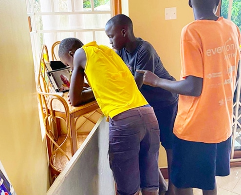 Boys talking to jane in Uganda