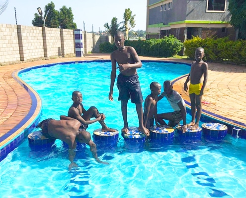 Former street boys at the swimming pool