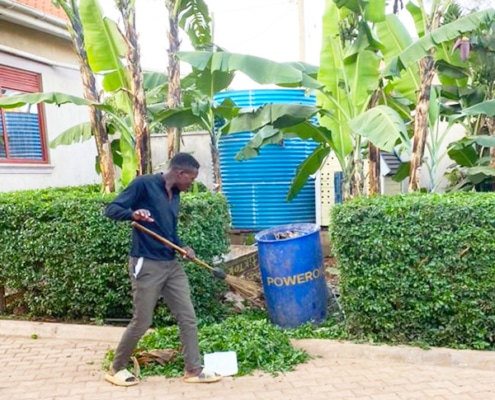 A former street boy now gardening