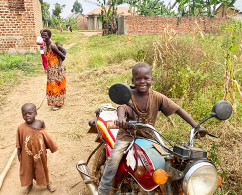 Motorbike used to transport roofing sheets