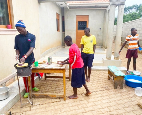 Our boys cooking chapatis