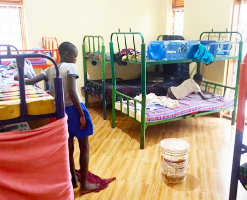 Former street children cleaning their rooms