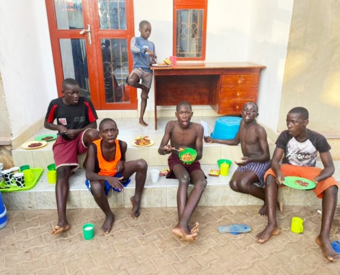 Former street children eating lunch