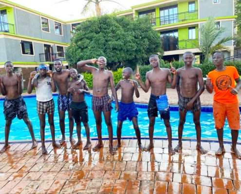 Former street boys at the pool