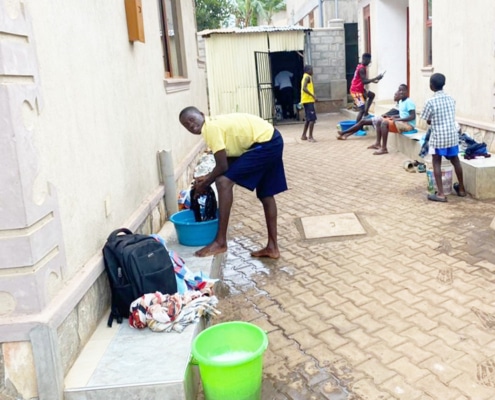 Former street children from Kampala washing their clothes