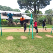 Our boys playing on the swings