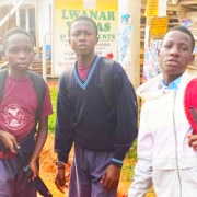 Three former street boys now at school