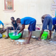 Former street boys washing their clothes