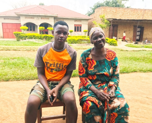 A former street boy with his mother