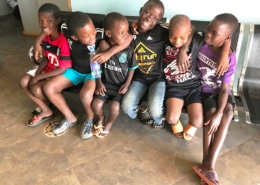Four Congolese refugee boys with two from Homes of Promise