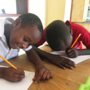 Former street children doing homework