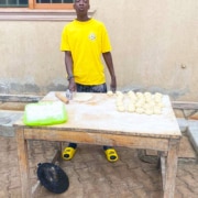 One of the boys making chapatis