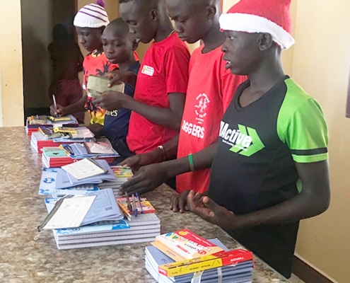 Five former street children prepare to return to school in Uganda